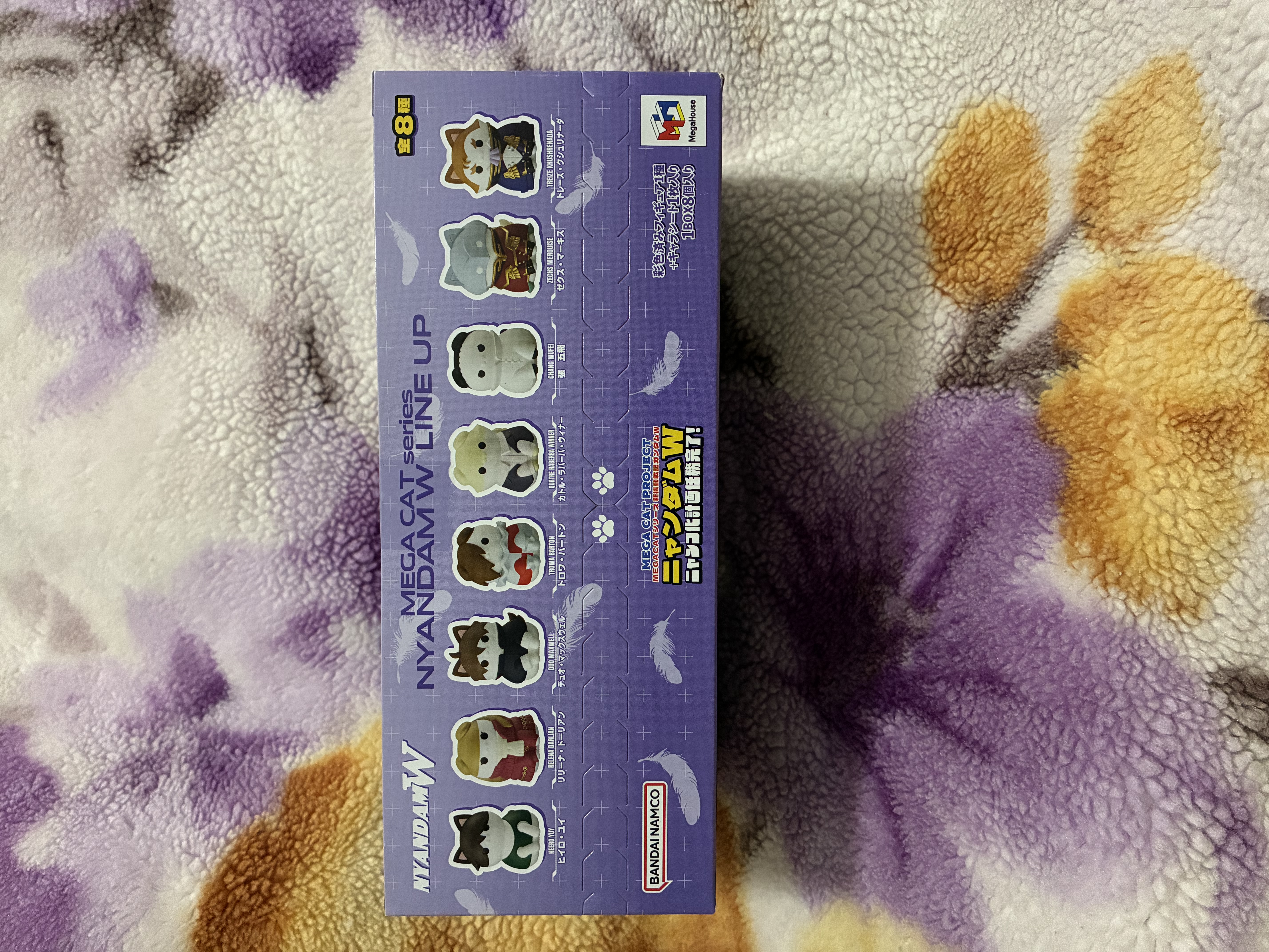 Box of Gundam wing cat figures showing the line up.
